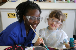 Demonstrator and pupil enjoying a science event